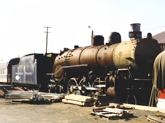 2156 upscaled a group of men standing next to a train